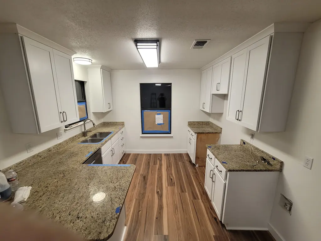 Wide view of finished refaced cabinets